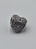 Pandora Pavé Heart Charm with Clear Heart Stone on a plain light background