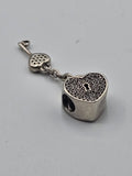 Pandora Pavé Heart Padlock and Key Charm on a plain light background