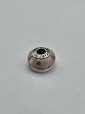 Pandora Peach and Plum Dot Murano Glass Charm on a plain light background
