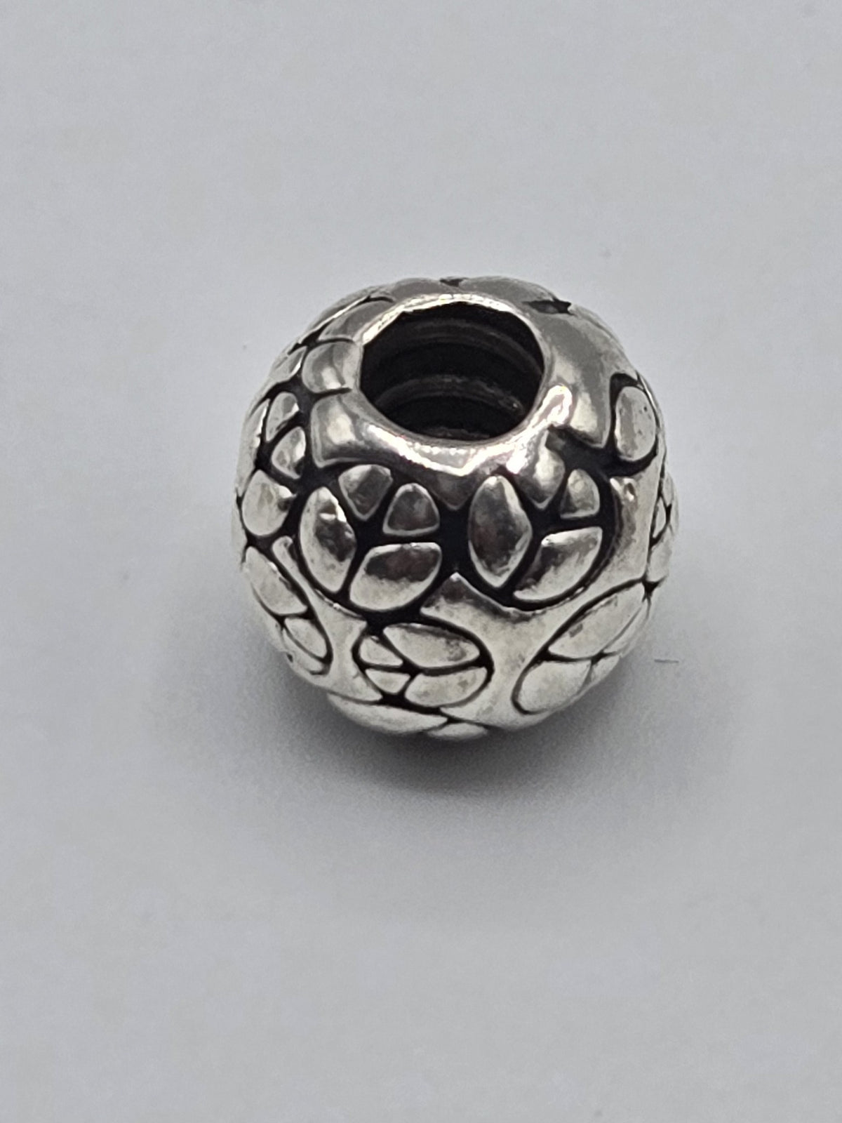 Pandora Petal Pattern Charm on a plain light background