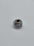 Pandora Pink and Blue Garden Flower Murano Glass Charm on a plain light background