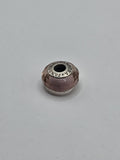 Pandora Pink Faceted Murano Glass Charm on a plain light background