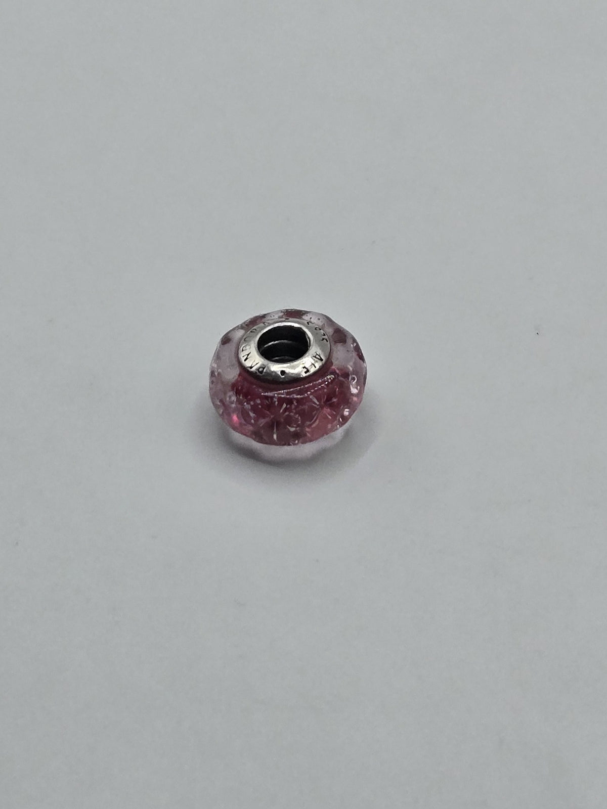 Pandora Pink Faceted Sparkle Murano Glass Charm on a plain light background