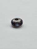 Pandora Plum and Pale Blue Flower Murano Glass Charm on a plain light background