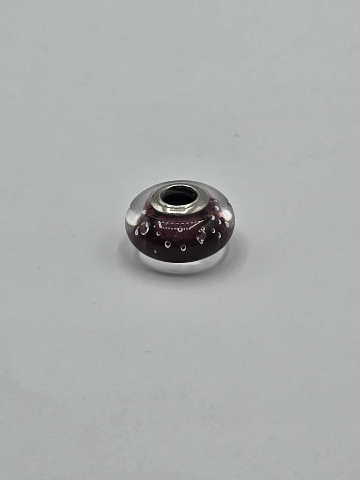 Pandora Plum Bubble Murano Glass Charm on a plain light background