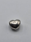 Pandora Polished Heart Charm on a plain light background