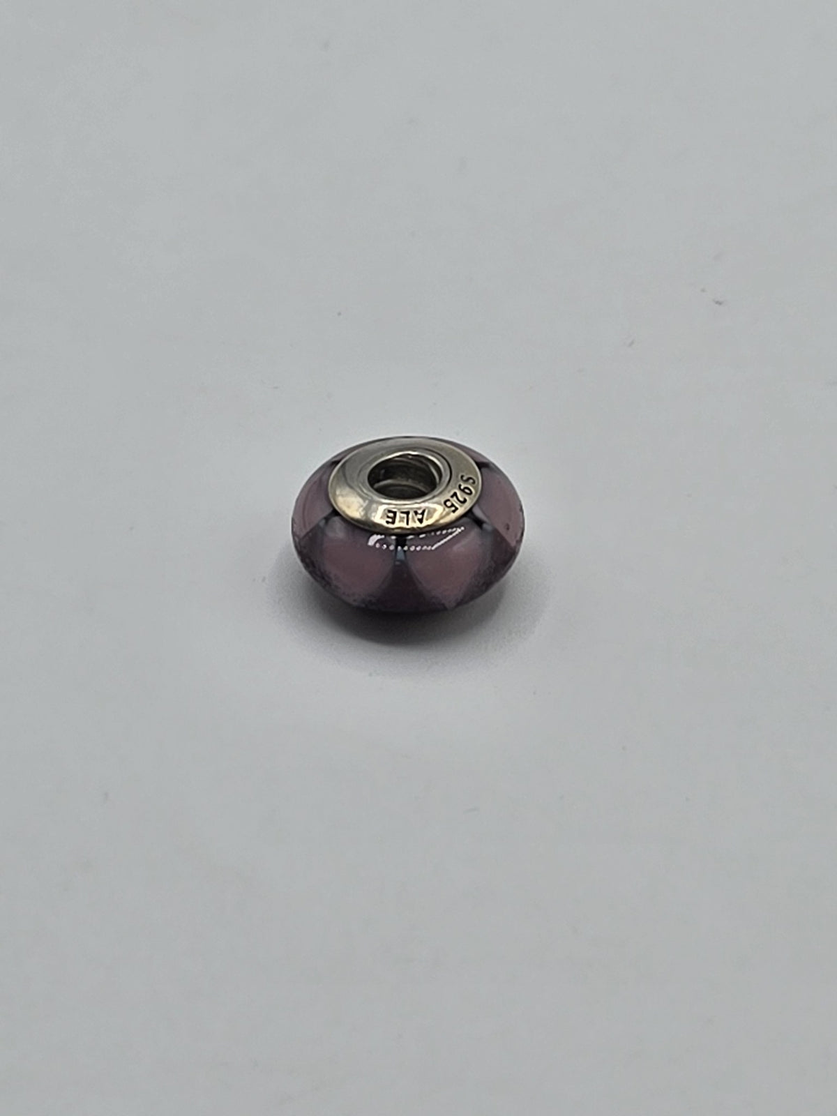 Pandora Purple and Pink Petal Faceted Murano Glass Charm on a plain light background