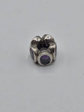 Pandora Purple Stone Flower Charm on a plain light background
