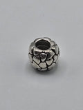 Pandora Raised Hearts Charm on a plain light background