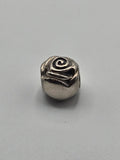 Pandora Rose Charm on a plain light background