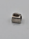 Pandora Silver Handbag Charm on a plain light background