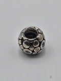 Pandora Silver Pebbles Charm with Pale Blue Stones on a plain light background