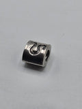Pandora Silver Wave Swirl Charm on a plain light background