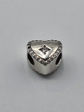 Pandora Sparkling Outline Heart Charm with Clear Stone on a plain light background