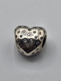 Pandora Sparkling Polka Dot Heart Charm on a plain light background