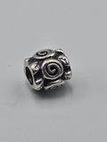 Pandora Spiral Roses Charm on a plain light background