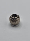 Pandora Stardust Openwork Hearts Charm on a plain light background
