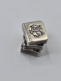 Pandora Study Books Charm on a plain light background