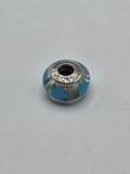 Pandora Turquoise and Silver Swirl Murano Glass Charm on a plain light background